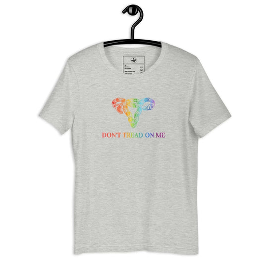 Light grey unisex t shirt with a rainbow pride graphic of a rattlesnake uterus and the words "Don't Tread On Me” by Anne Lesniak