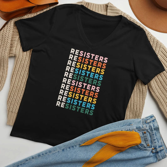 Resisters black v neck women’s t-shirt styled flat laying out on a sweater with jeans by Rebel Girl Rampage