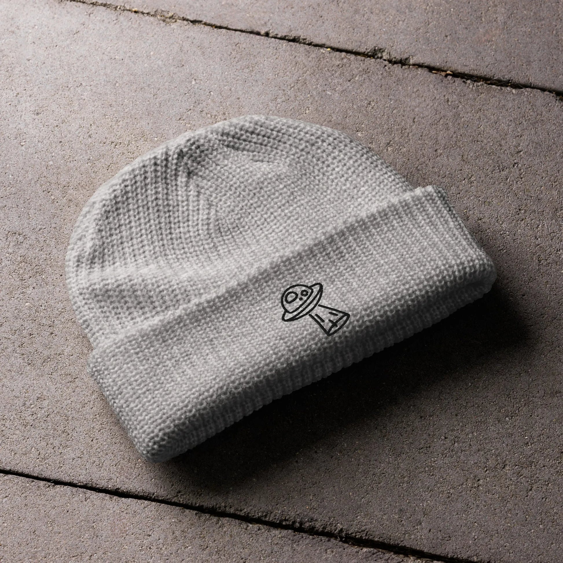 UFO alien fun playful embroidered black graphic on a light grey beanie, whimsical, Rebel Girl Rampage