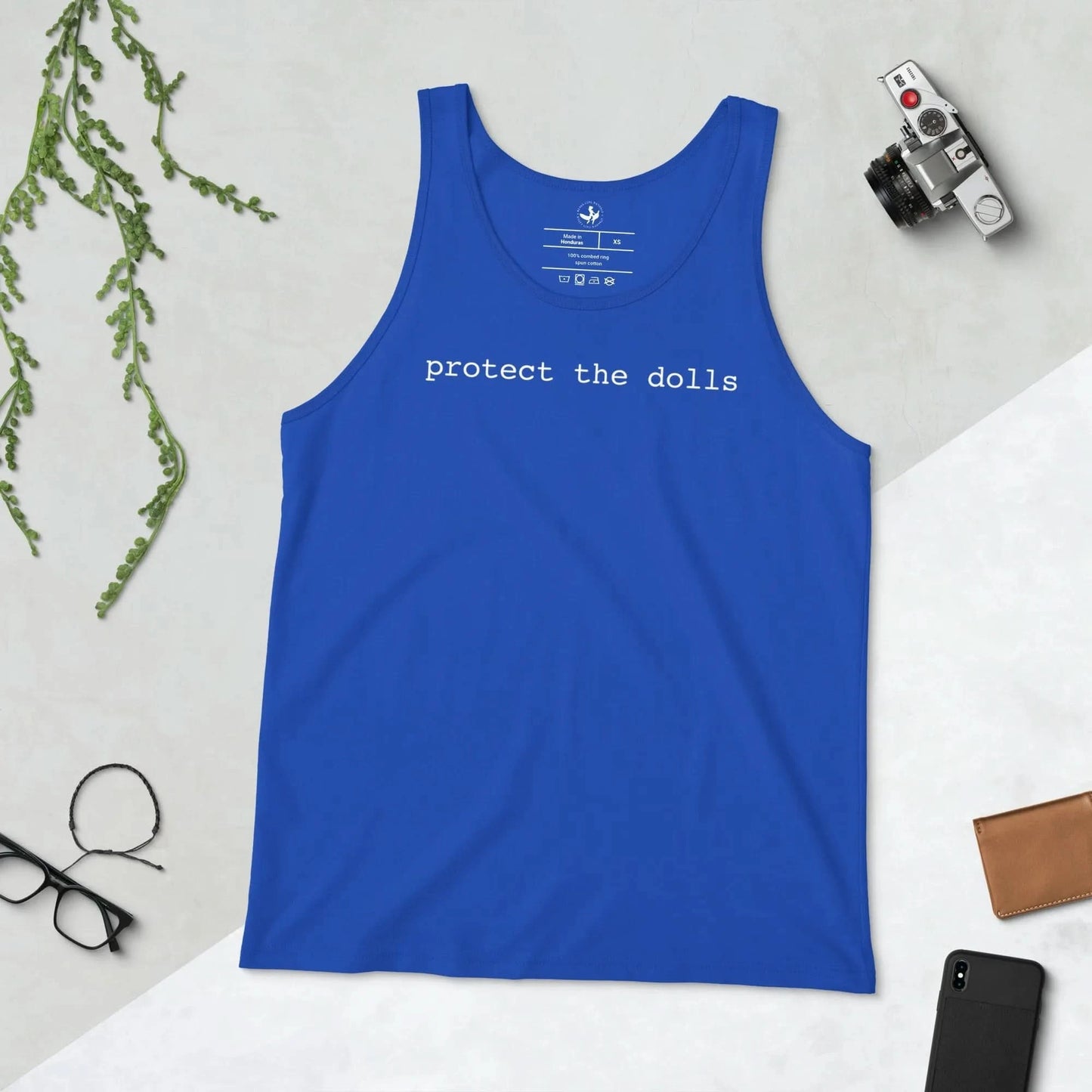 Blue tank top with 'protect the dolls' text on a light gray background, men’s tank top, Fundraising shirt for trans lifeline, Rebel Girl Rampage