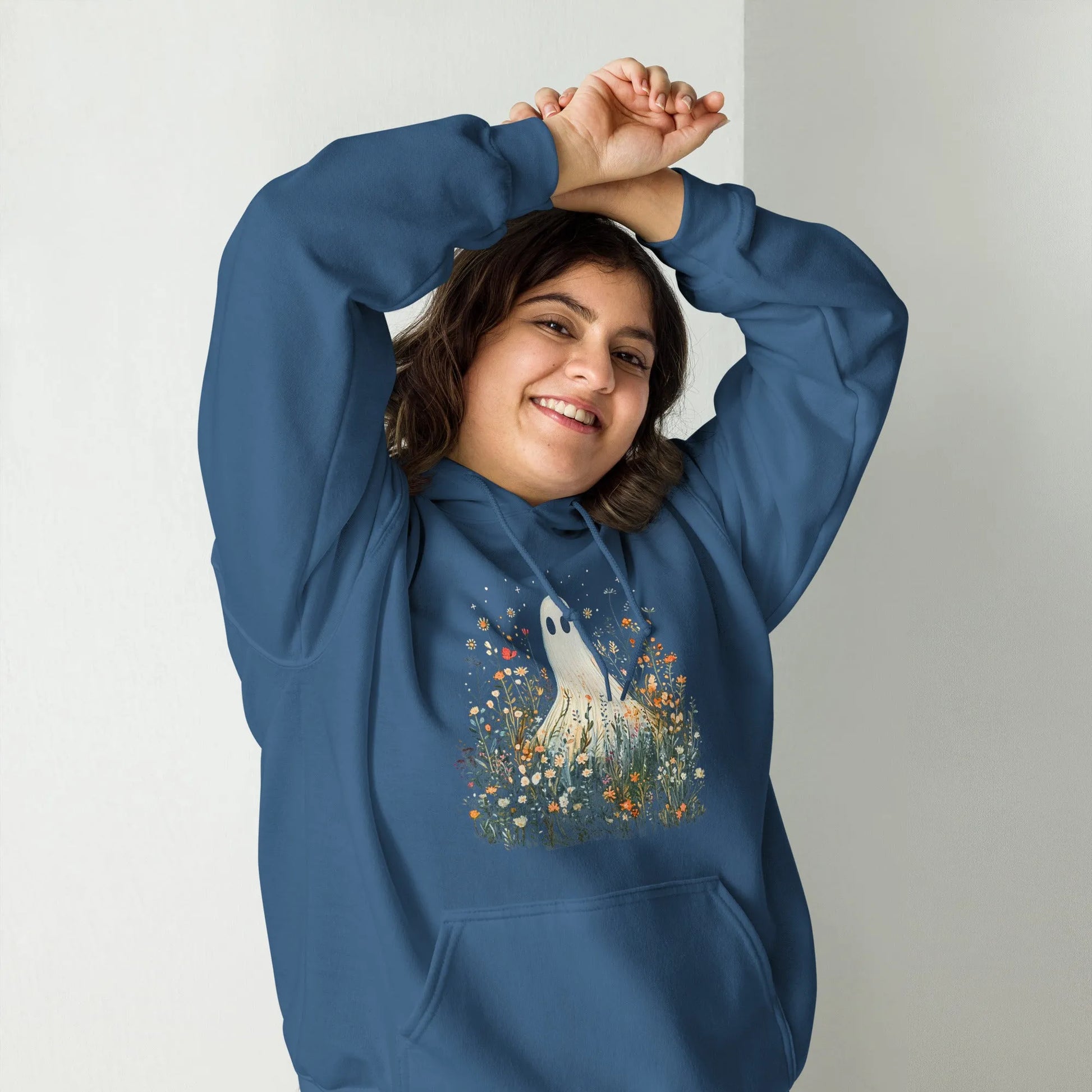 Cute ghost graphic in a field of flowers and foliage on a blue unisex hoodie, spooky season, cute, Rebel Girl Rampage