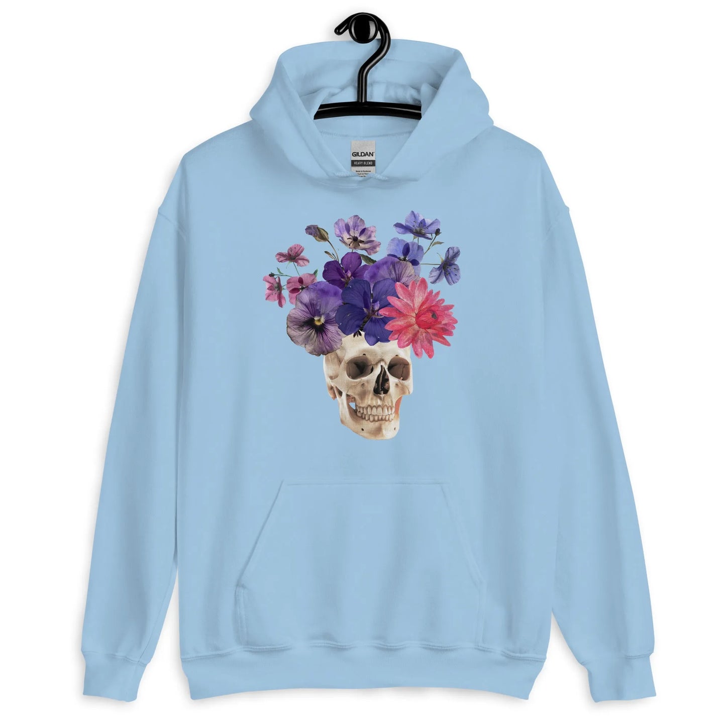 Skull graphic with beautiful pink and purple flowers on a light blue hoodie, macabre, beautiful, nature, witchy, floral, spooky season, Rebel Girl Rampage
