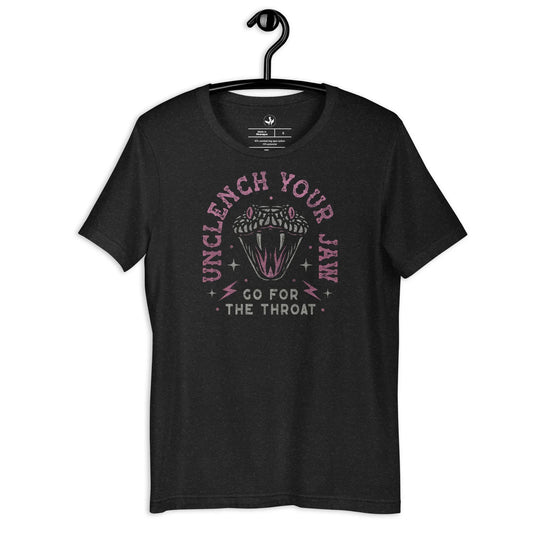 Pink and white snake graphic with the words, "Unclench Your Jaw Go For the Throat" on a black heather unisex t shirt, make a statement and be empowered to take on the powers that be, Rebel Girl Rampage