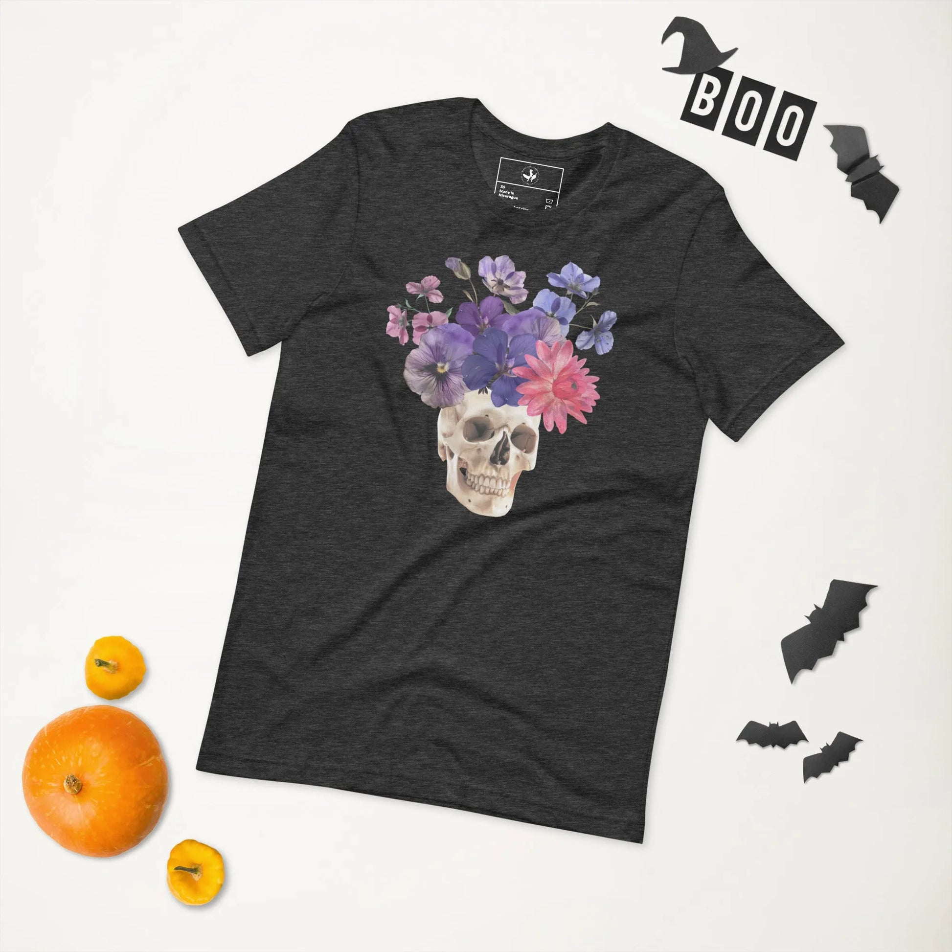 Skull graphic with beautiful pink and purple flowers on a grey unisex t shirt, macabre, beautiful, nature, witchy, floral, spooky season, Rebel Girl Rampage