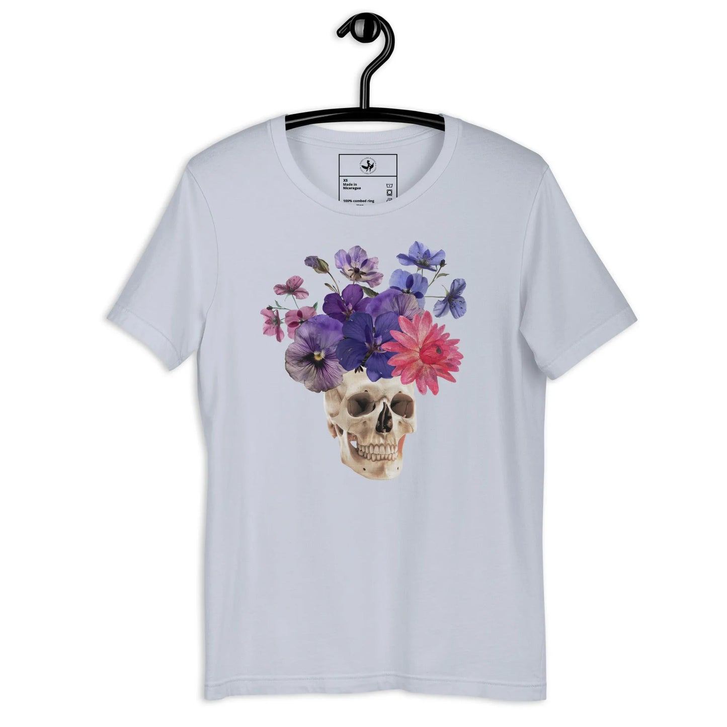 Skull graphic with beautiful pink and purple flowers on an ice blue unisex t shirt, macabre, beautiful, nature, witchy, floral, spooky season, Rebel Girl Rampage