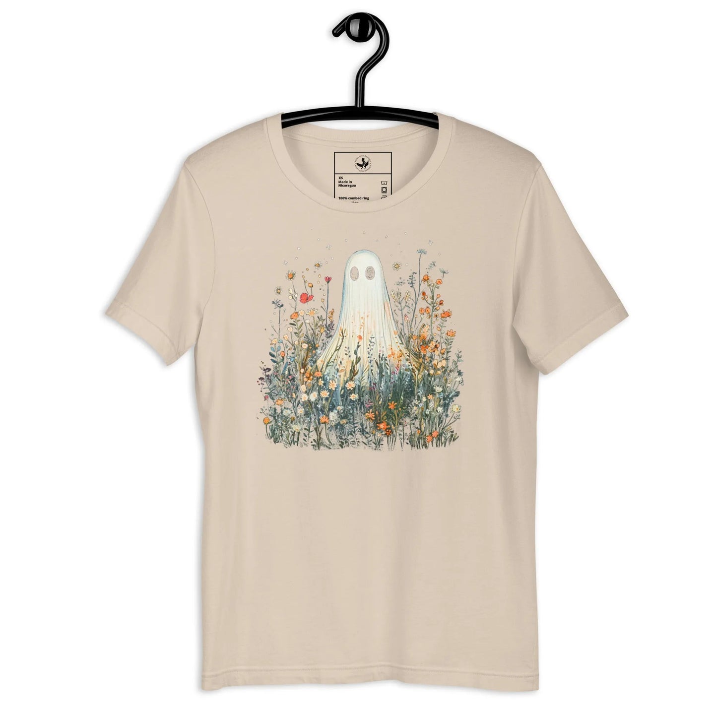 Cute ghost graphic in a field of flowers and foliage on a cream unisex t shirt, spooky season, cute, Rebel Girl Rampage