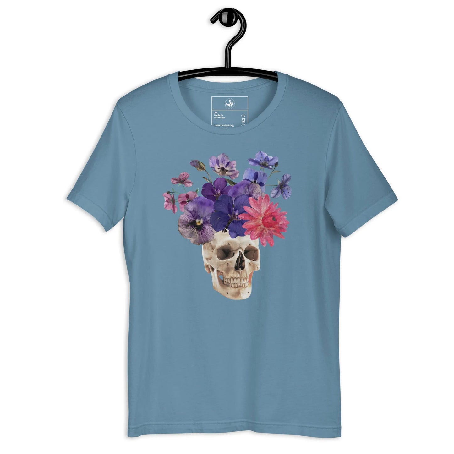 Skull graphic with beautiful pink and purple flowers on a blue unisex t shirt, macabre, beautiful, nature, witchy, floral, spooky season, Rebel Girl Rampage