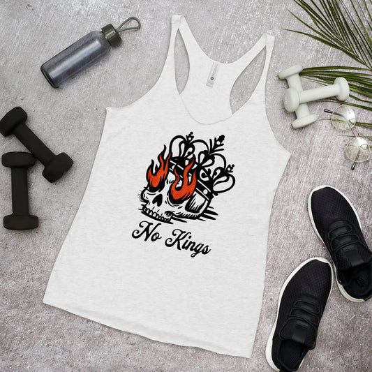 White tank top with a skull and flames design and 'No Kings' text, placed on a gray surface with fitness items Rebel Girl Rampage