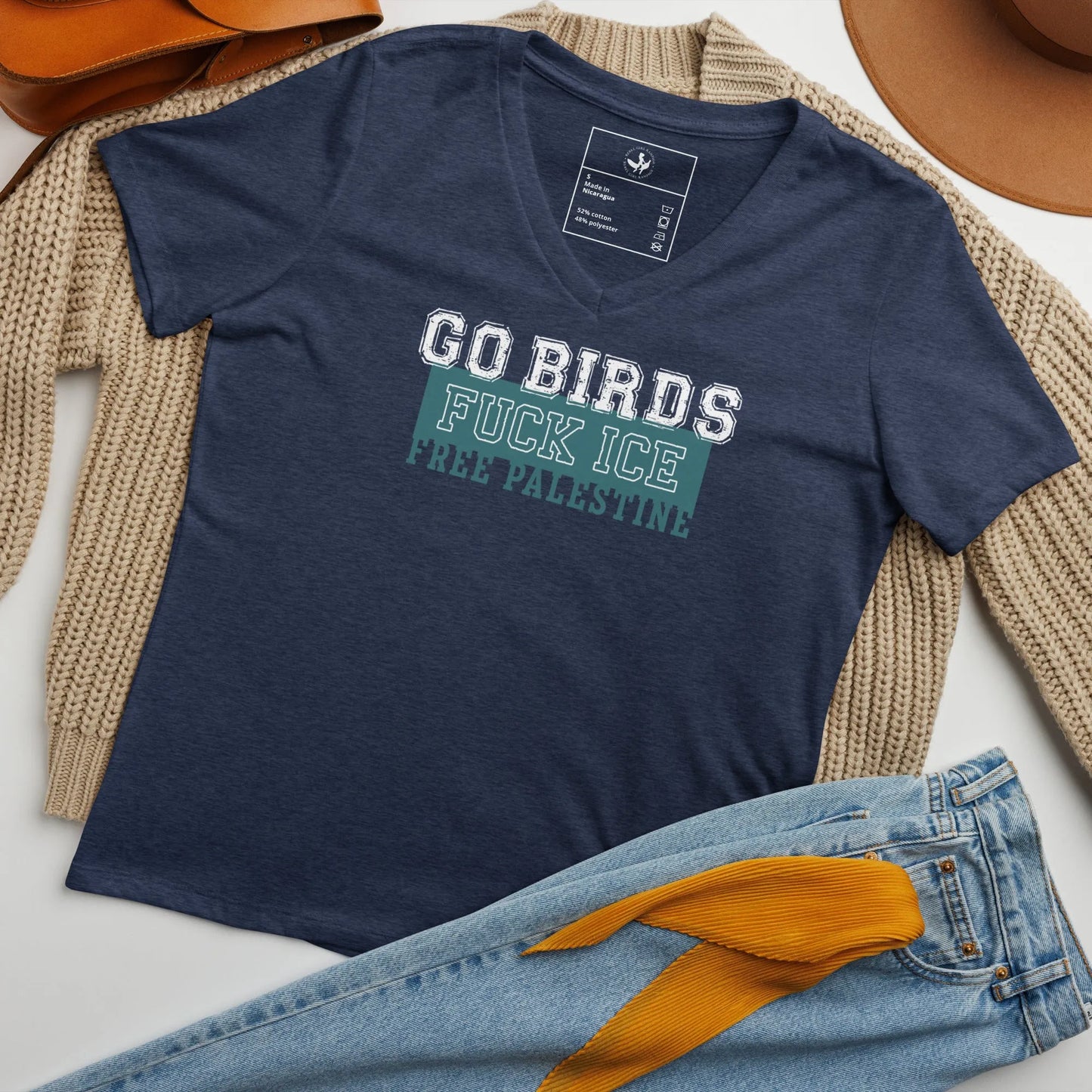 Go Birds, F ICE, Free Palestine sports letters graphic on a navy v-neck t shirt, sports, birds, anti-ICE, equality, protest shirts, Rebel Girl Rampage