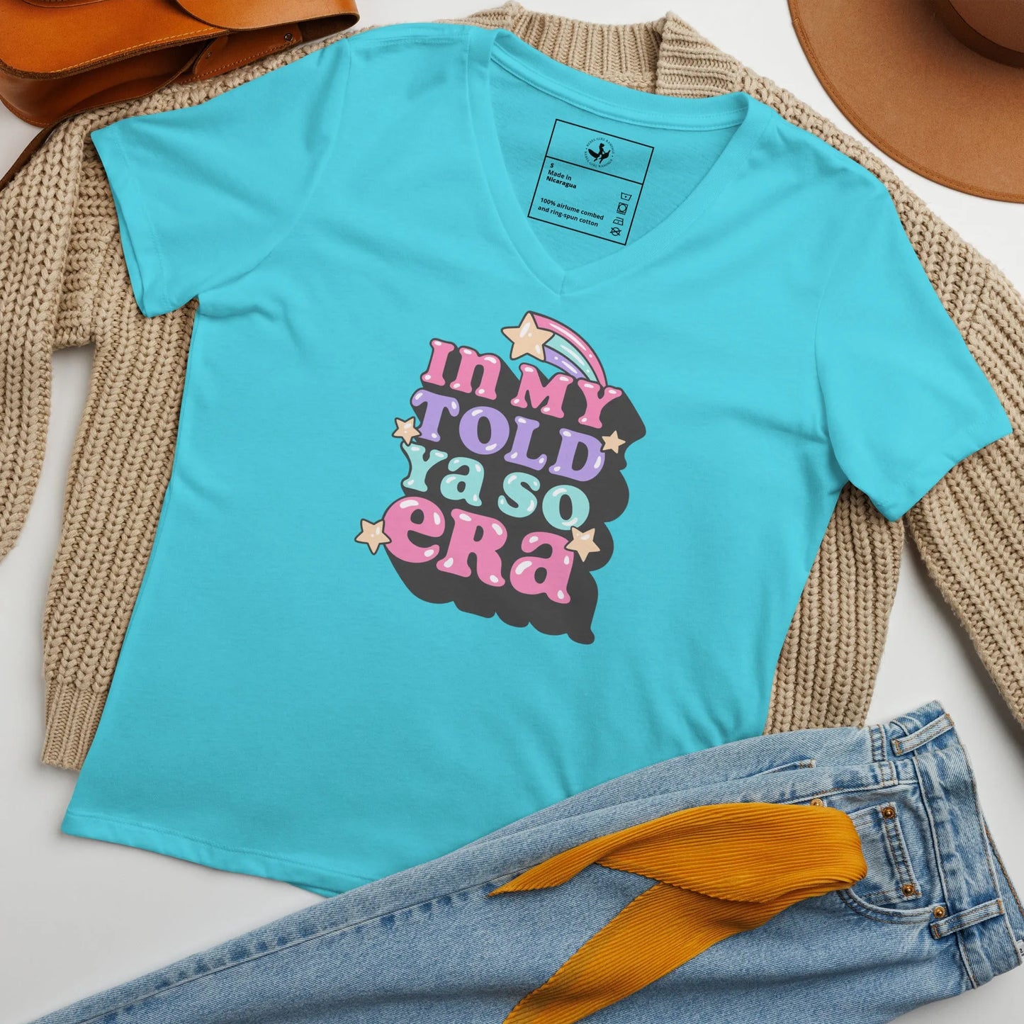 Pink v-neck t shirt with "In my told ya so era" pink, purple, and light blue graphic lettering with stars, speak your mind and tell them, "I told ya so" with a shirt as sassy as you, Rebel Girl Rampage.