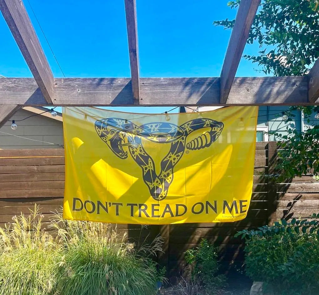 Don’t Tread On Me Snake Uterus Feminist Abortion Rights Outdoor Garden Banner women’s reproductive rights flag by Anne Lesniak at Rebel Girl Rampage