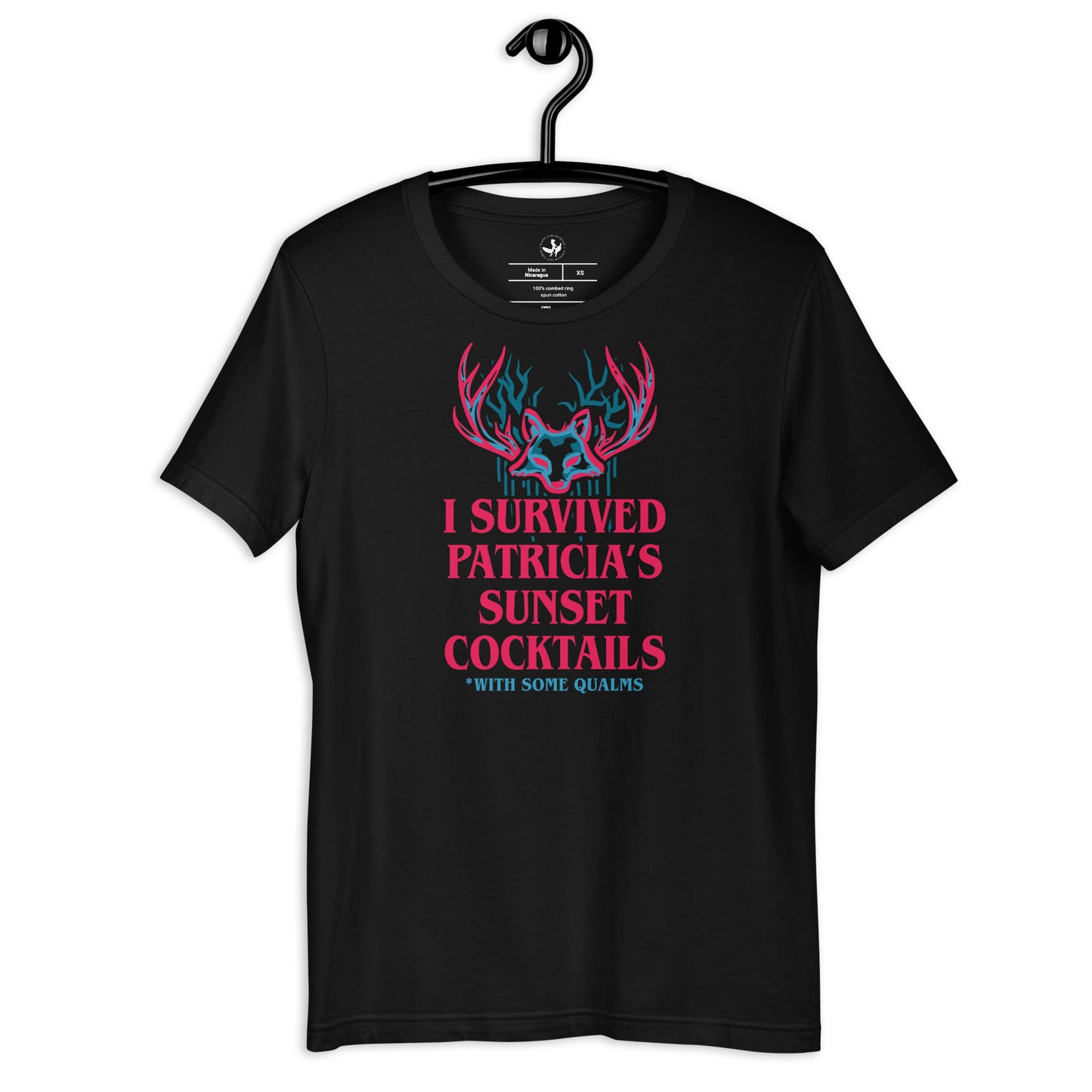 Black unisex t-shirt on a hanger with a psychedelic graphic that says, “I survived Patricia’s Sunset Cocktails” at Rebel Girl Rampage 