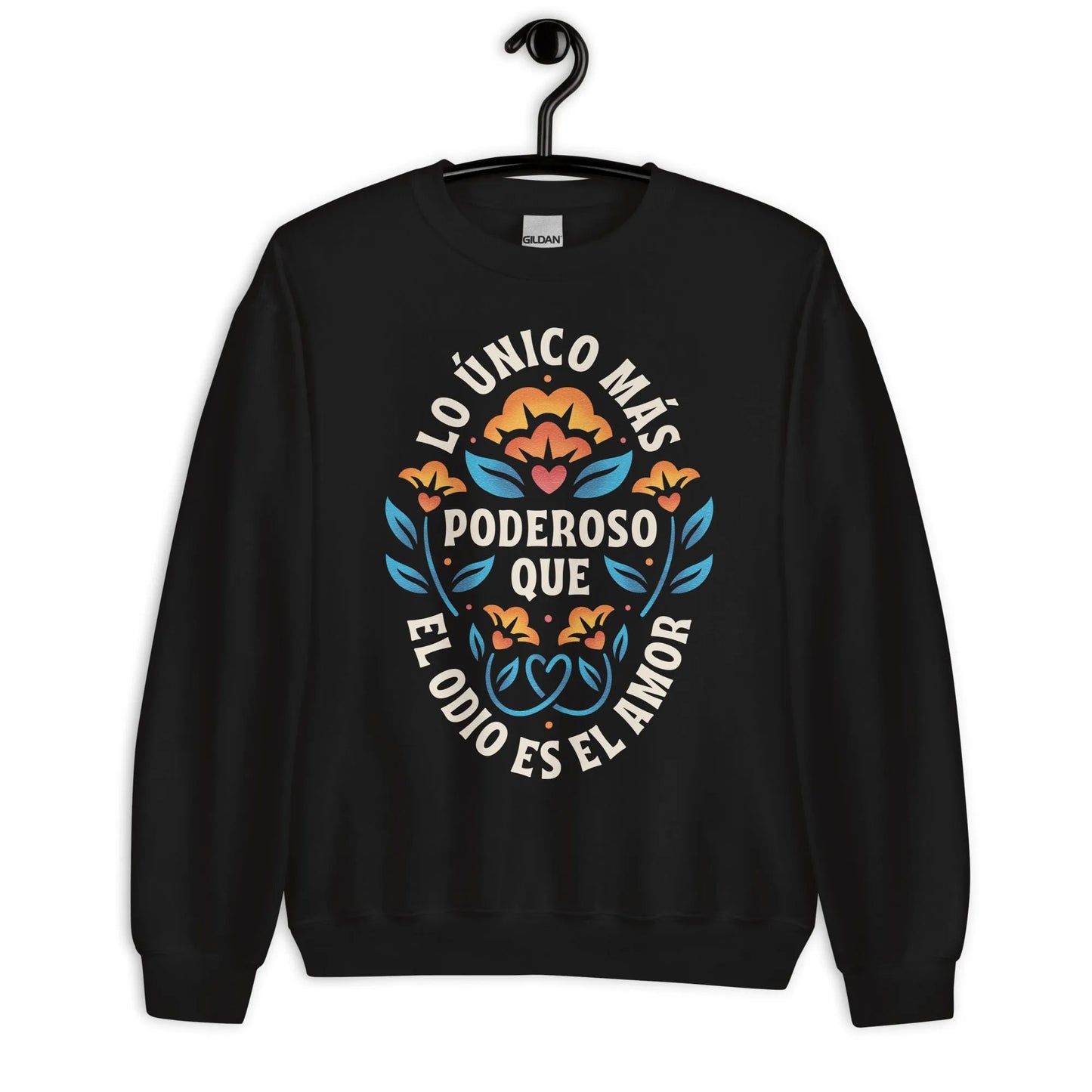 Black unisex crewneck sweatshirt with a flower graphic and words that say, "Lo unicorn has poderoso que el odio es el amor." Love is more powerful than hate, bad bunny quote, super bowl halftime show 2026, Rebel Girl Rampage