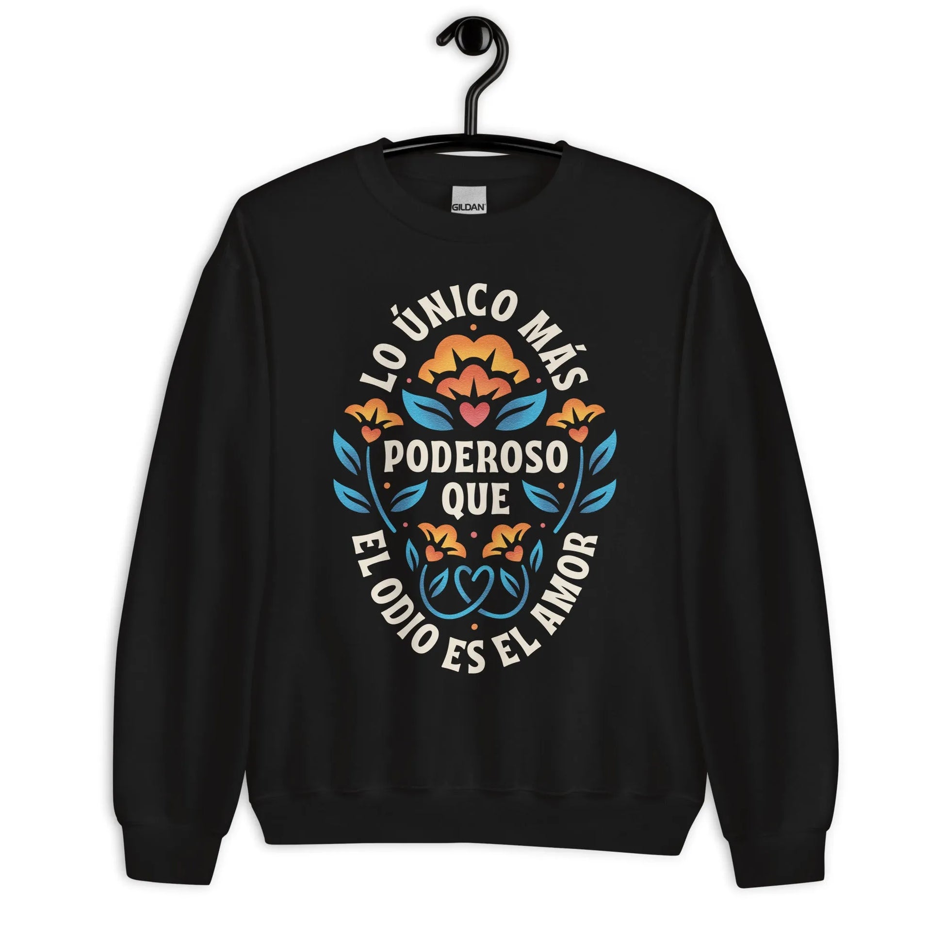 Black unisex crewneck sweatshirt with a flower graphic and words that say, "Lo unicorn has poderoso que el odio es el amor." Love is more powerful than hate, bad bunny quote, super bowl halftime show 2026, Rebel Girl Rampage