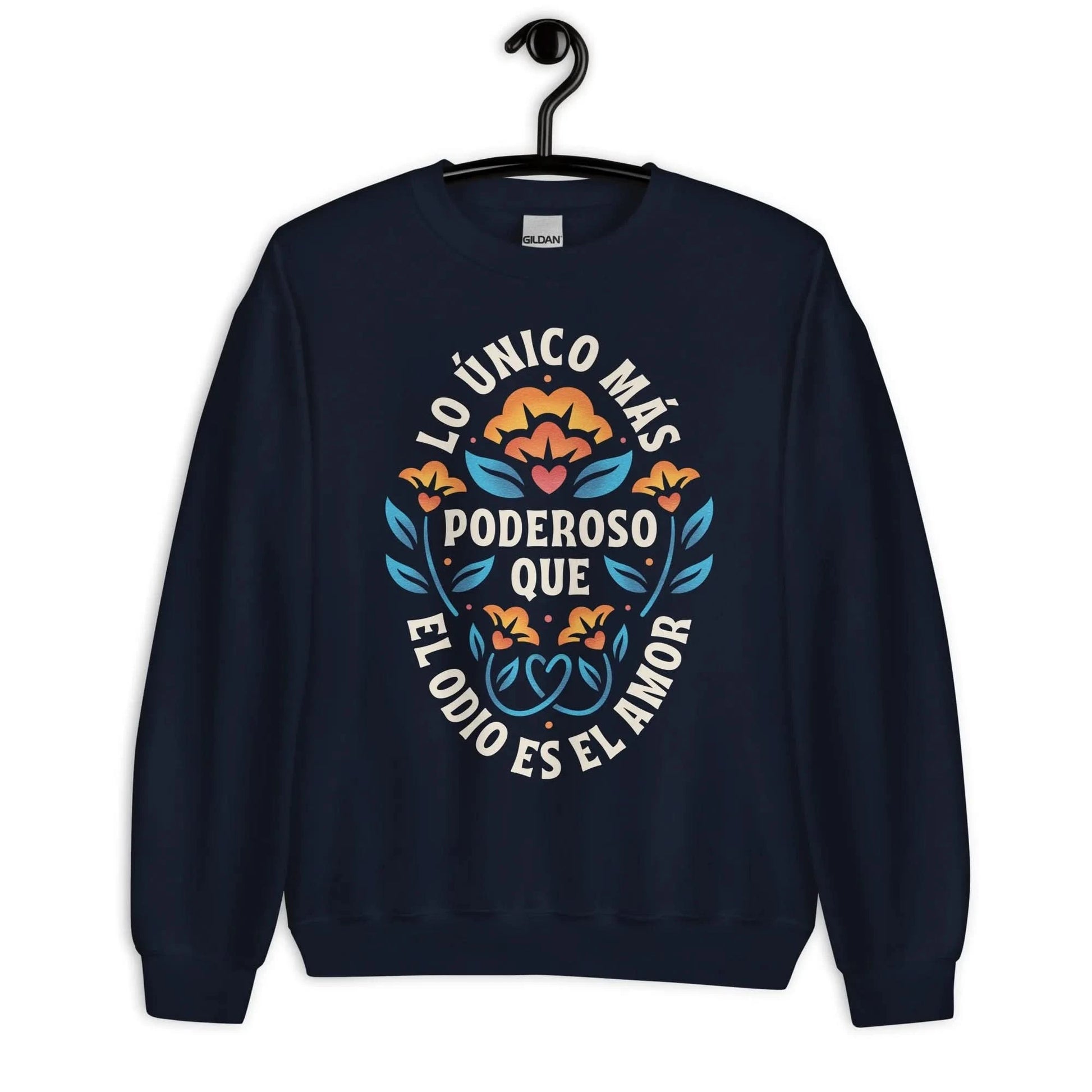 Navy unisex crewneck sweatshirt with a flower graphic and words that say, "Lo unicorn has poderoso que el odio es el amor." Love is more powerful than hate, bad bunny quote, super bowl halftime show 2026, Rebel Girl Rampage