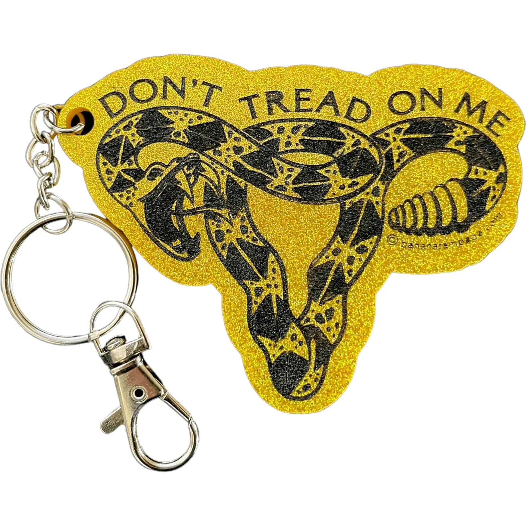 Rattlesnake Uterus don’t tread on me yellow glitter keychain supporting women’s healthcare, trans rights at Rebel Girl Rampage