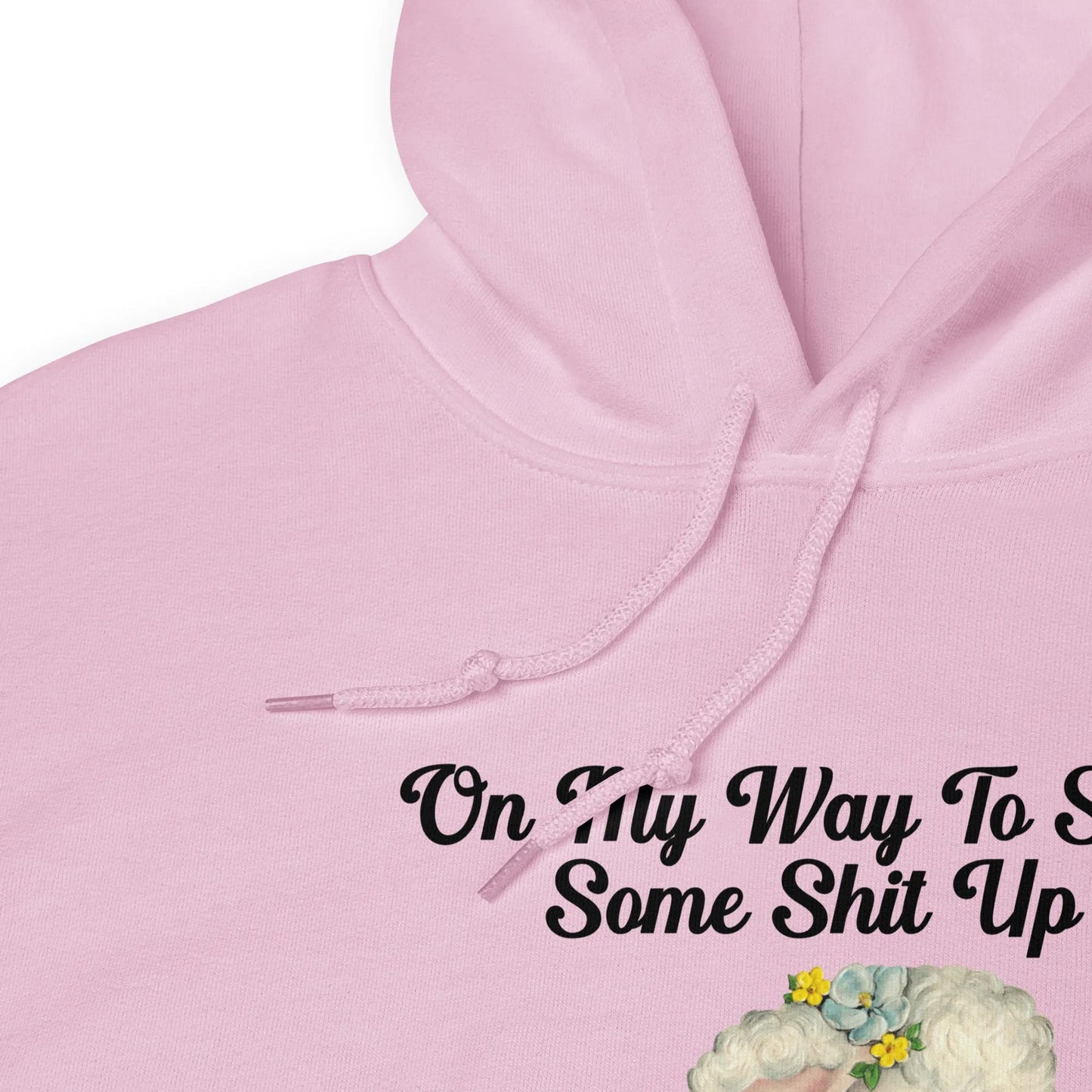 Light pink hoodie with a cute cartoon lamb with text that says, "on my way to stir some shit up." Cute & sassy graphic design, Rebel Girl Rampage 