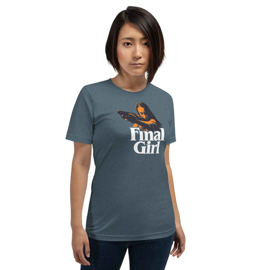 Person wearing a blue  Widow’s Bay t-shirt with a graphic and text that says Final Girl on a white background  at Rebel Girl Rampage 