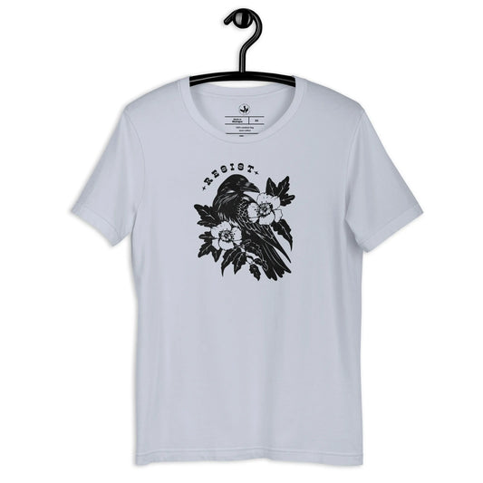 Resist Crow Floral and Leafy Graphic on a light blue unisex t shirt, witchy nature vibes, Rebel Girl Rampage