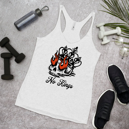 White tank top with a skull and flames design and 'No Kings' text, placed on a gray surface with fitness items Rebel Girl Rampage 