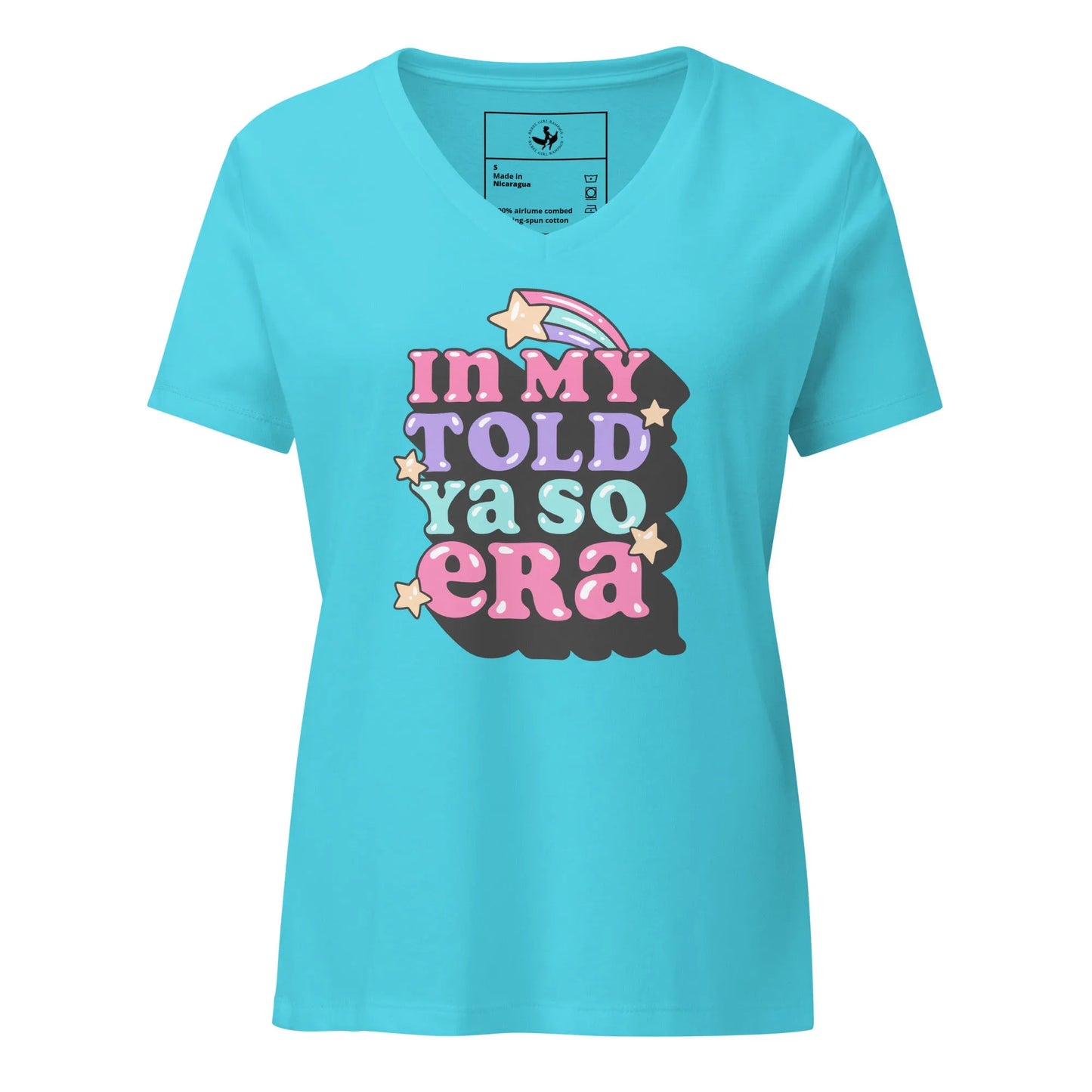 Blue v-neck t shirt with "In my told ya so era" pink, purple, and light blue graphic lettering with stars, speak your mind and tell them, "I told ya so" with a shirt as sassy as you, Rebel Girl Rampage.